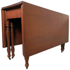 Antique Drop Leaf Table On Casters