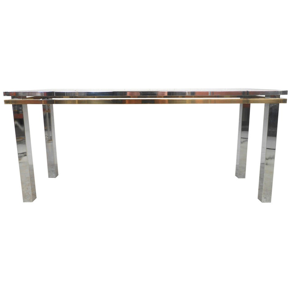This beautiful chrome, brass and glass sofa table features the design style of midcentury designer Paul Evans and is perfect for use as a console or sofa table. Beautiful lines and beveled glass top make this lovely vintage table an eye-catching