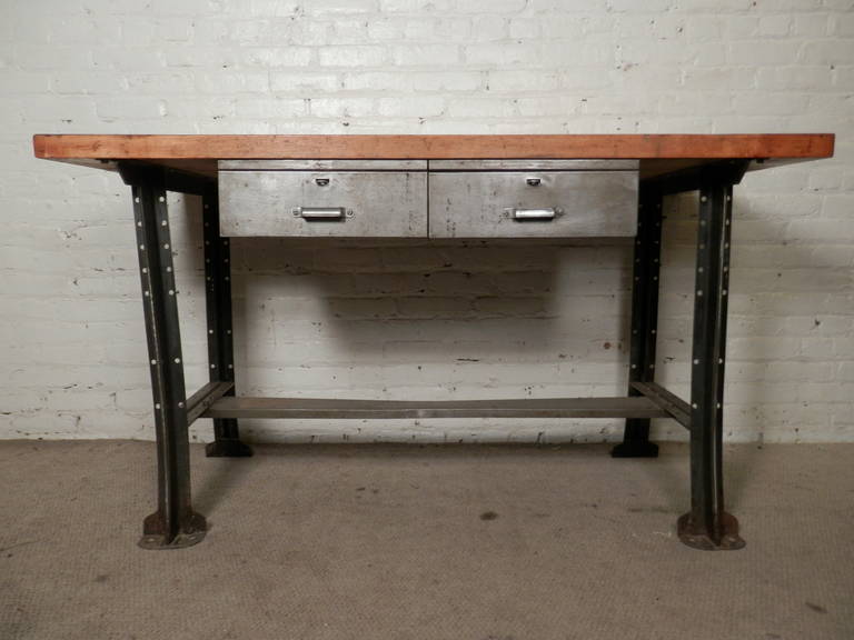 Butcher block top factory table with heavy metal base. Metal has been stripped to bare metal and lacquered for a handsome industrial look, which can take this vintage workshop table into your modern home.

(Please confirm item location - NY or NJ