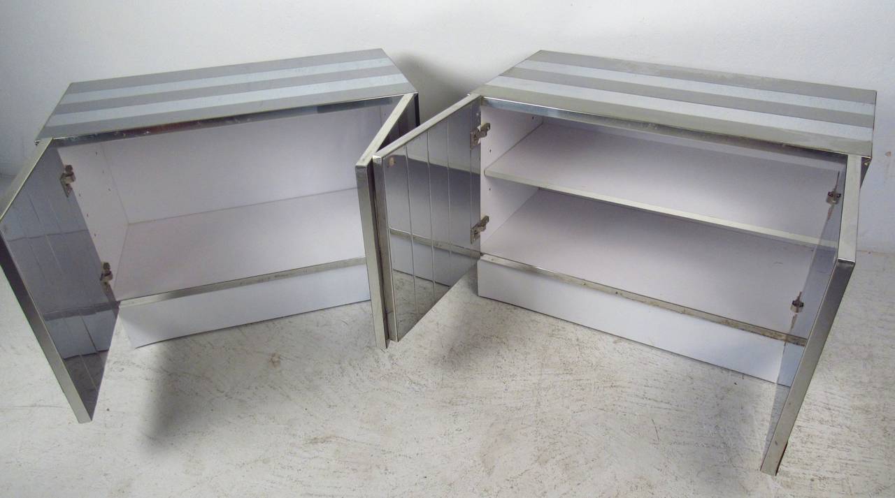 Mid-century modern two door cabinets with striped polished and matte chrome top, sides and front. Ample storage, adjustable shelf. Great as sofa side cabinets.

(Please confirm item location - NY or NJ - with dealer)