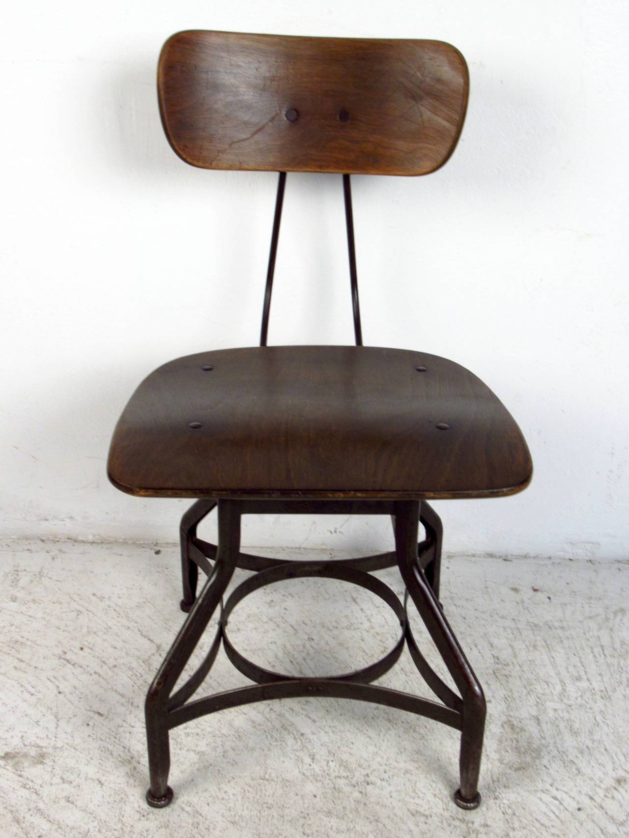 This depression era industrial stool by Toledo Metal Furniture Company features a solid steel construction, bentwood back, and unique vintagae base which offers a distinct flare to any home or office.

Please confirm item location (NY or NJ) with