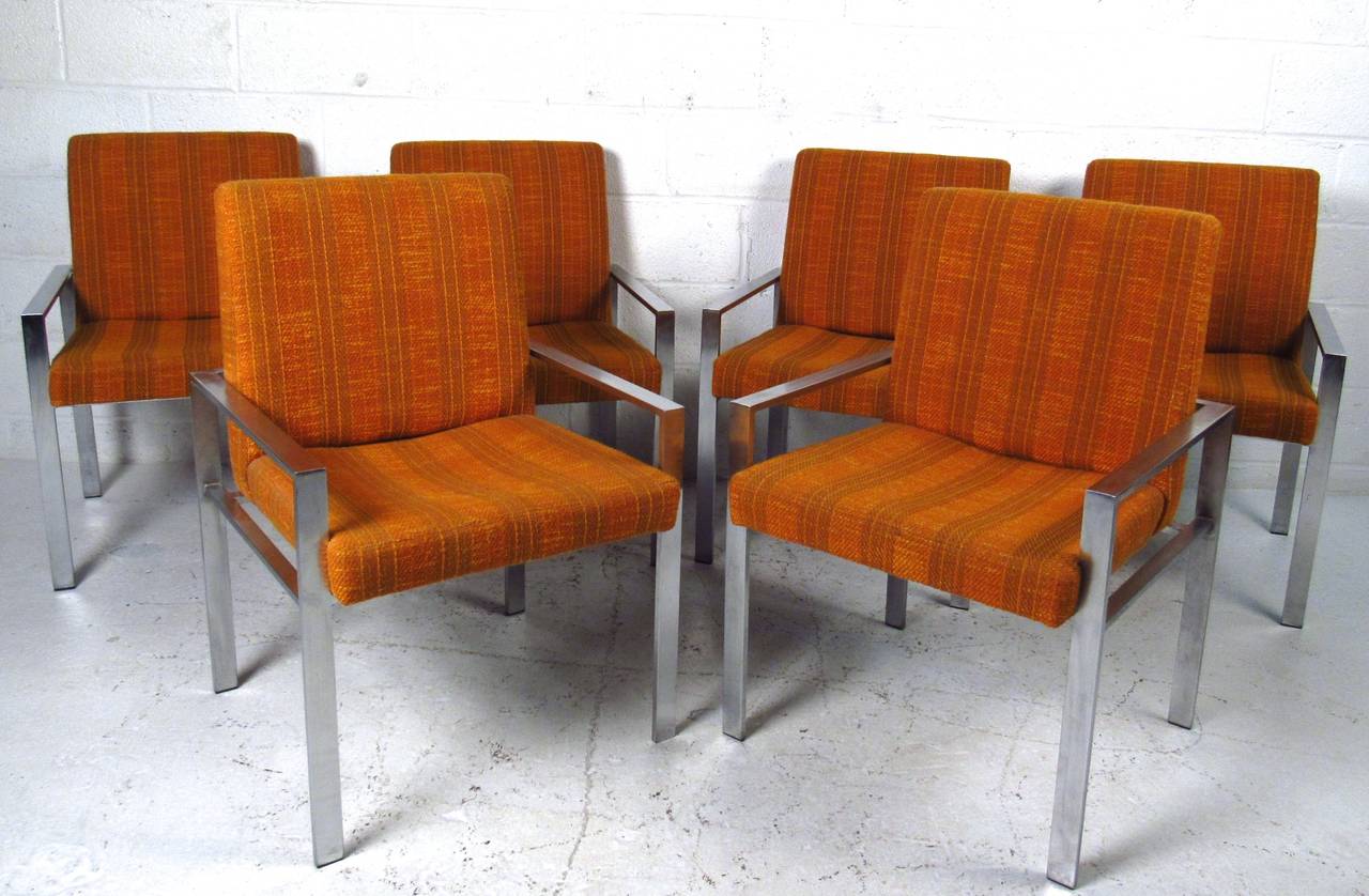 This set of six Mid-Century armchairs features wonderful vintage fabric, sturdy metal frames and comfortable design. Perfect for dining, conference or waiting room these versatile chairs feature Knoll style design. Please confirm item location (NY