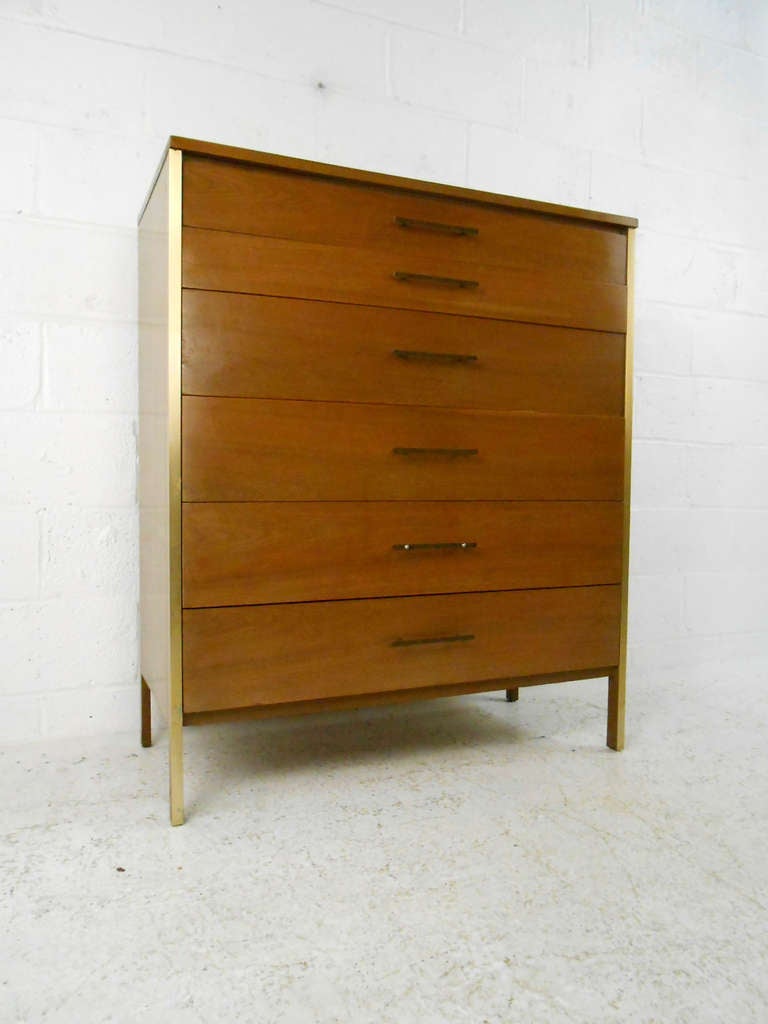 This McCobb for Calvin Group dresser features iconic metal trim and drawer pulls as well as spacious storage ability. This classic mid-century modern bedroom dresser makes a great addition to any collection. Please confirm item location (NY or NJ).