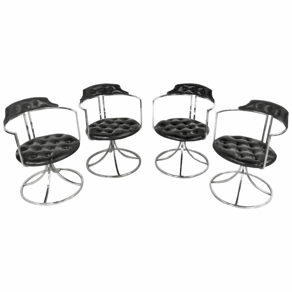 Set of Mid-Century Chrome And Vinyl Swivel Dining Chairs