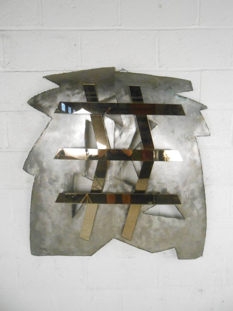 This modernist wall sculpture by D. Selig features mirrored glass mounted on steel.

Please confirm item location (NY or NJ) with dealer.