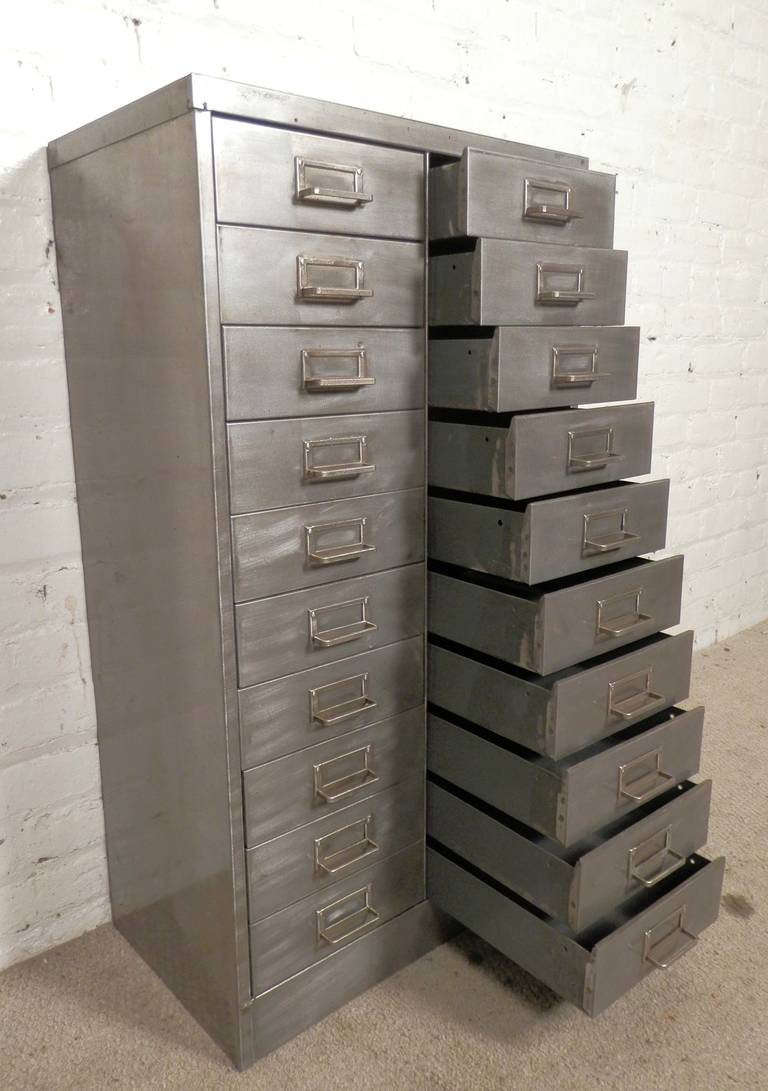 Newly restored twenty drawer file unit with original handles and tag holders. Stripped to bare metal and given a handsome industrial style finish that works in your modern home or office.

Each drawer measures - 9