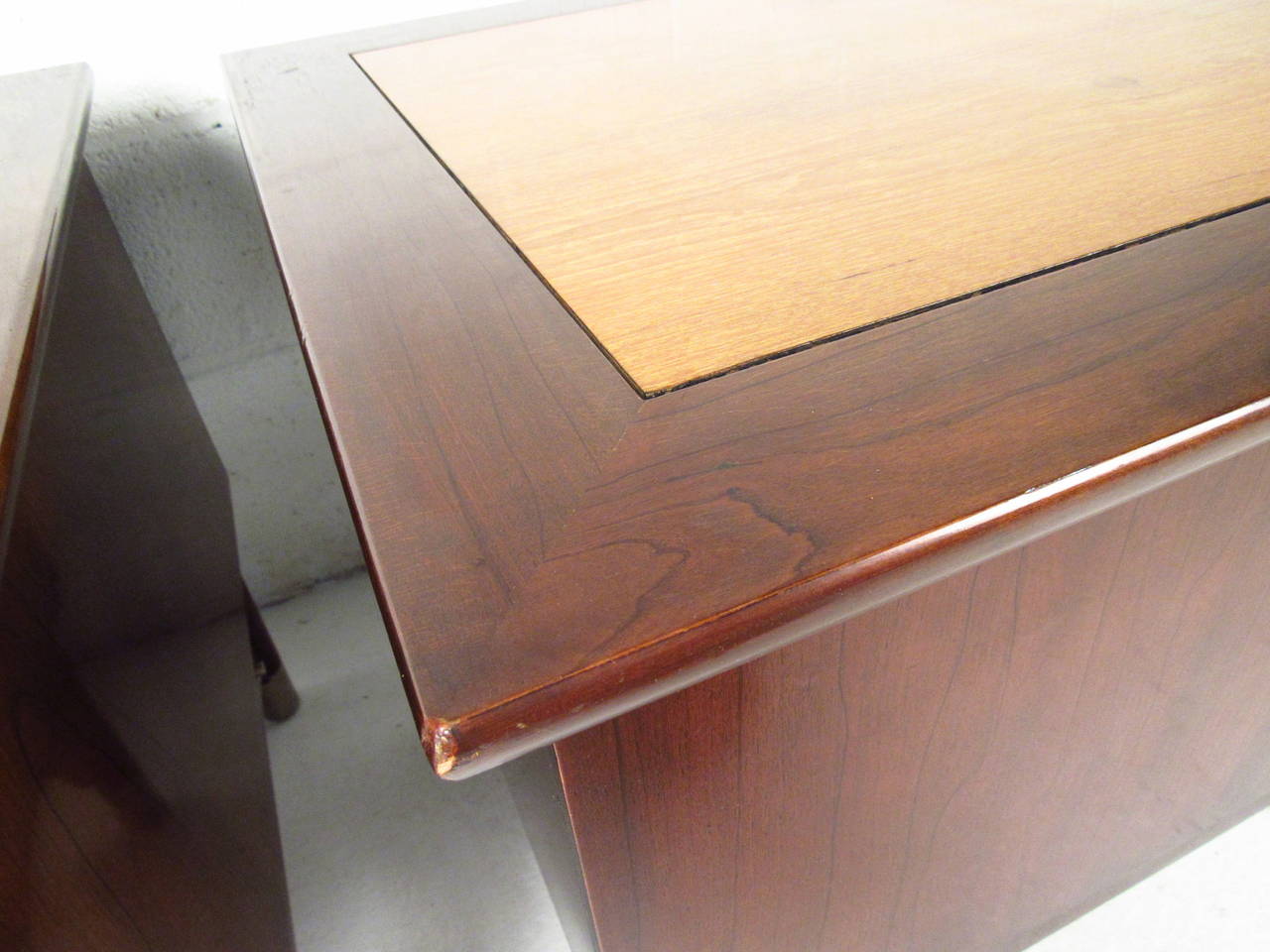 Two vintage-modern nightstands, each features beautiful walnut and oak grain, two drawers with sculpted chrome pulls and chrome accenting on legs. Manufactured by Weiman.

Please confirm item location NY or NJ with dealer.