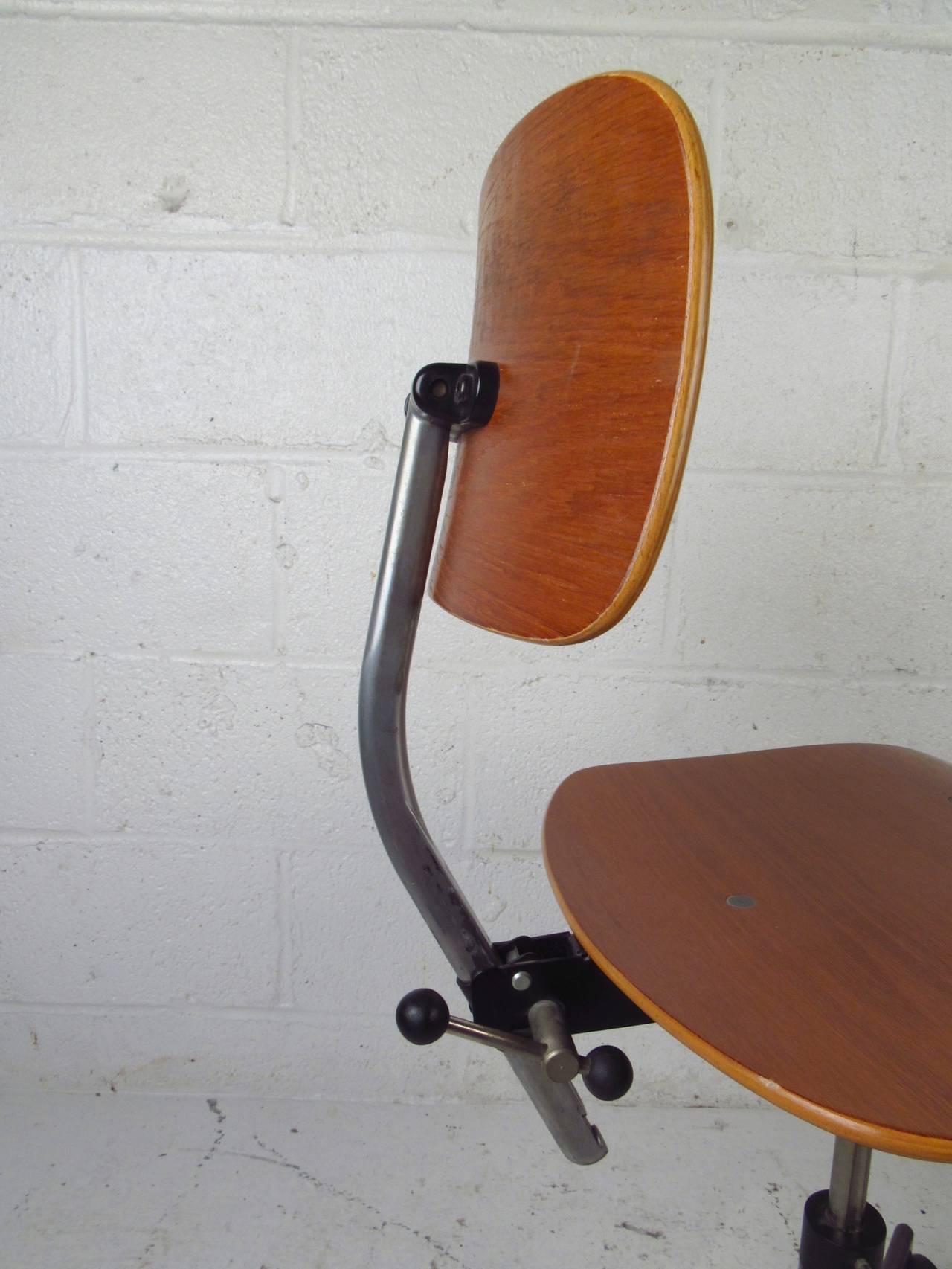 Comfortable desk chair by Kevi, made with bentwood seat and back, metal frame. 360 degree casters, adjustable seat and back height.

(Please confirm item location - NY or NJ - with dealer)