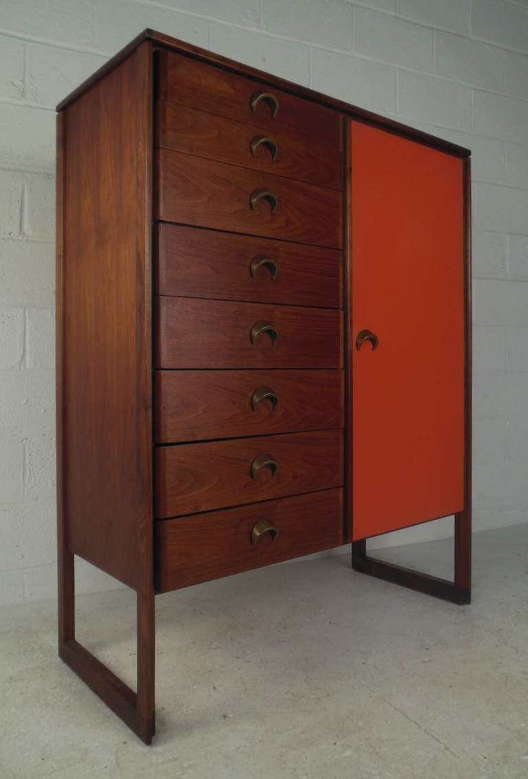 Tall chest of drawers featuring crescent pulls, exposed legs with floor stretchers and finished back. 

Please confirm item location (NY or NJ) with dealer.