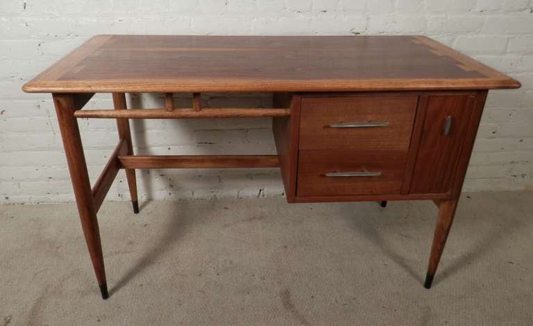 Mid-century modern desk with classic Lane dovetailing of oak and walnut. Smooth, curved edges, tapered legs, vintage flaired hardware. Designed by Andre Bus for Lane's 