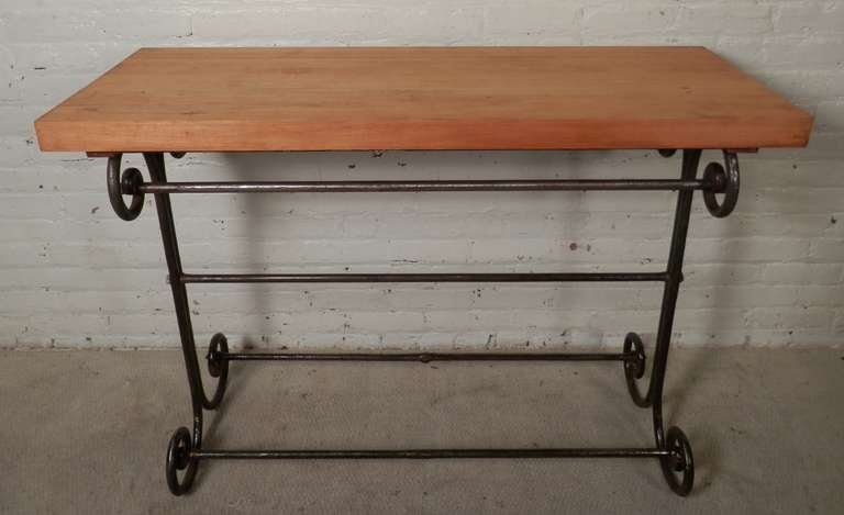 Butcher block top table with solid iron base. Lovely scrolled accents.

(Please confirm item location - NY or NJ - with dealer)