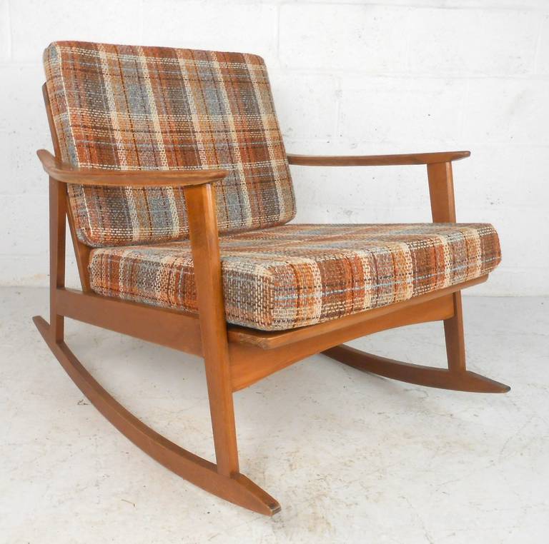 American made walnut rocker with solid construction and thick cushions. Similar to the style of rockers designed by Ib-Kofod Larsen. 

(Please confirm item location - NY or NJ - with dealer).