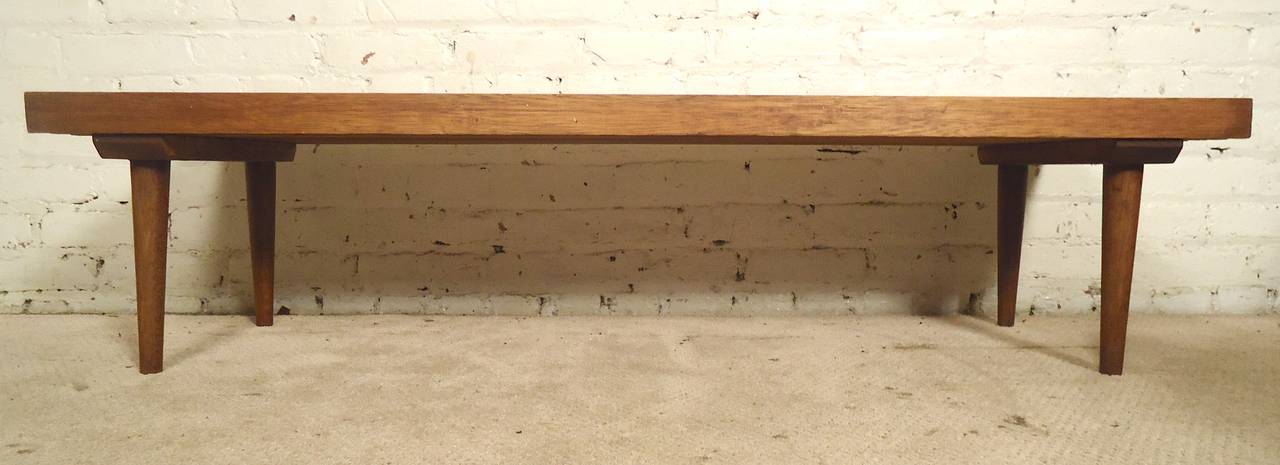 Classic slat bench or table in walnut with tapered legs. Great as a living room table or window bench.

(Please confirm item location - NY or NJ - with dealer).