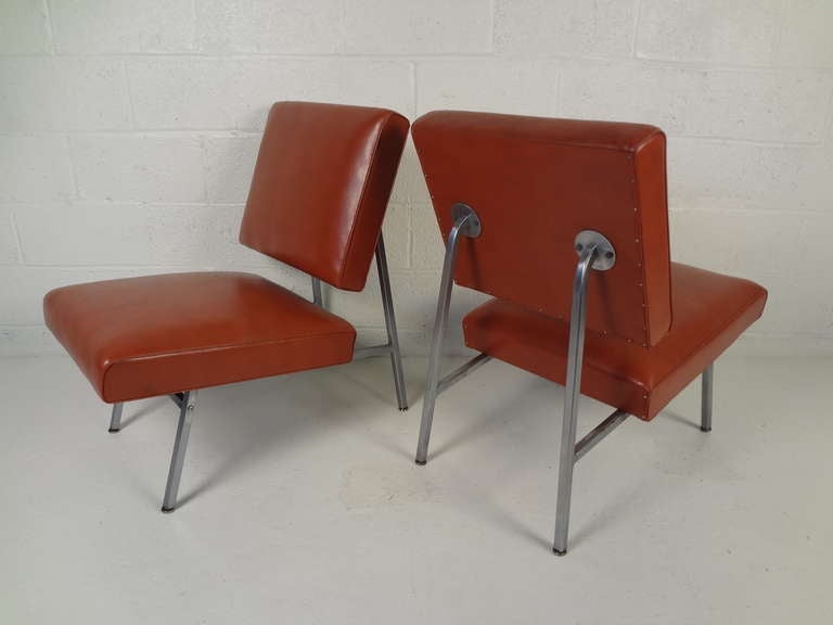 Great pair of vinyl covered, low-slung lounge chairs from Royal Metal Manufacturing Co. Please confirm item location (NY or NJ) with dealer.