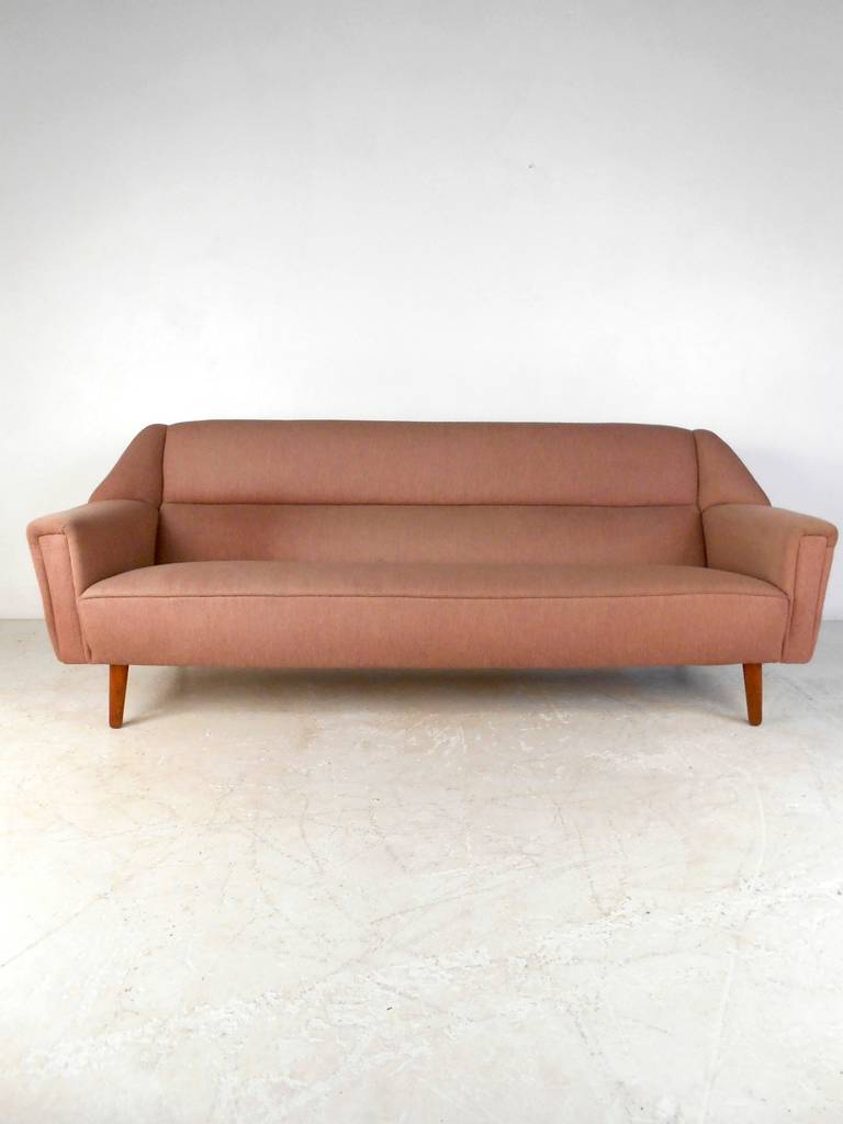 This Danish modern sofa features comfortable upholstery and sturdy teak legs which offer a bold style to any home or office space.

Please confirm item location (NY or NJ) with dealer.