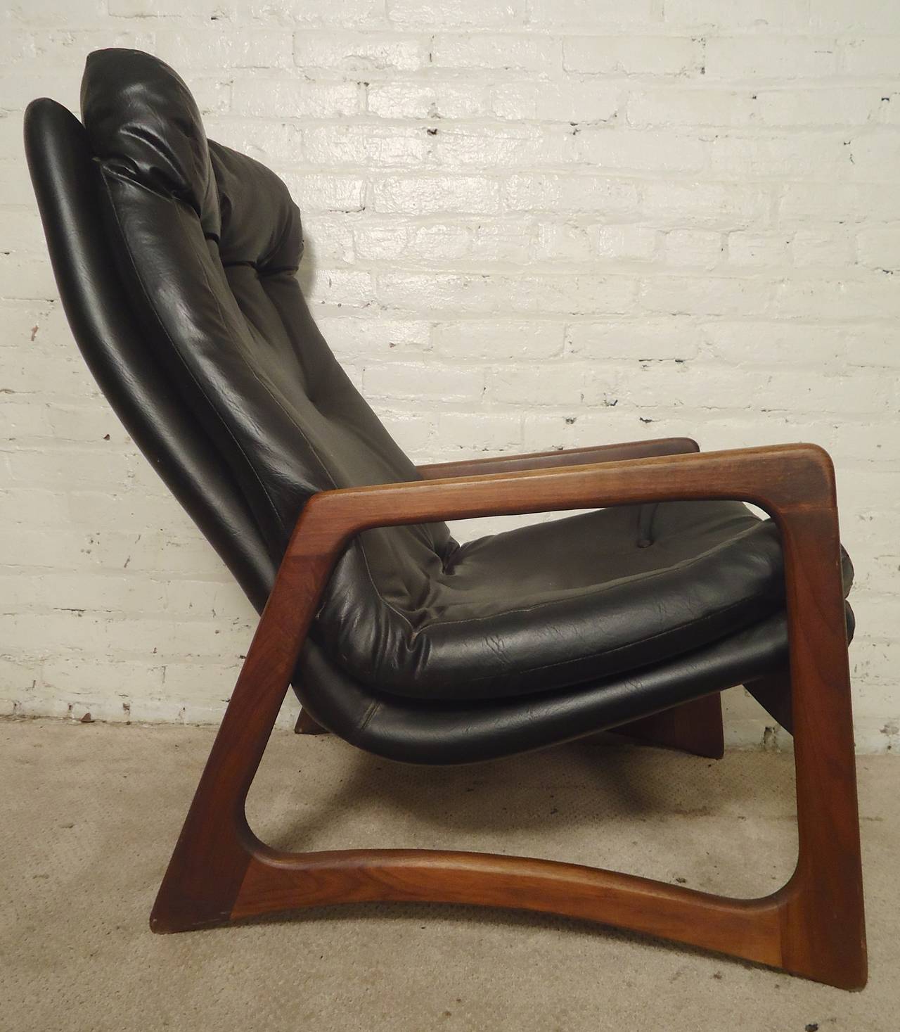 Mid-Century Modern sculpted lounge chair by Adrian Pearsall. Tufted back, walnut frame, comfortable back and seat. Great formed living room chair.

(Please confirm item location, NY or NJ, with dealer).