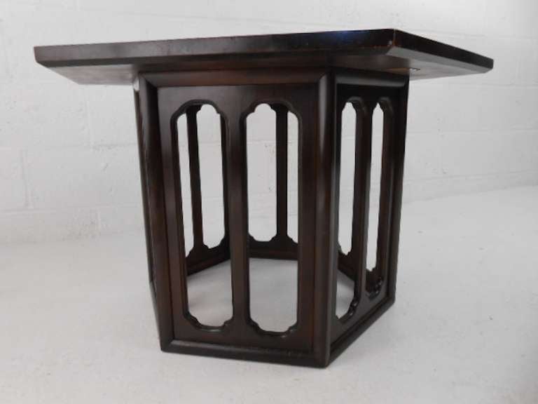 Mid-Century octagonal lacquered side table features stylish sculpted base and makes a striking addition to home or business interior. Grand Rapids Furniture makers guild for Widdicomb. Please confirm item location (NY or NJ) with dealer.