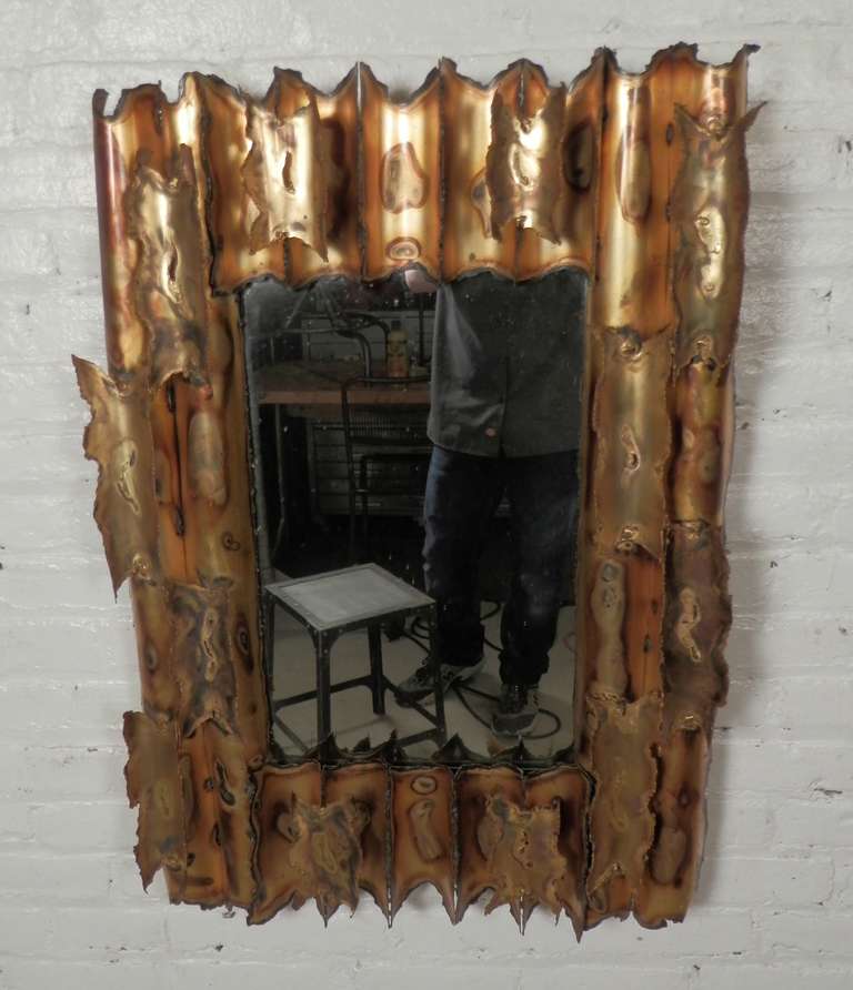 Great brutalist mirror made of welded brass and copper.

(Please confirm item location - NY or NJ - with dealer)