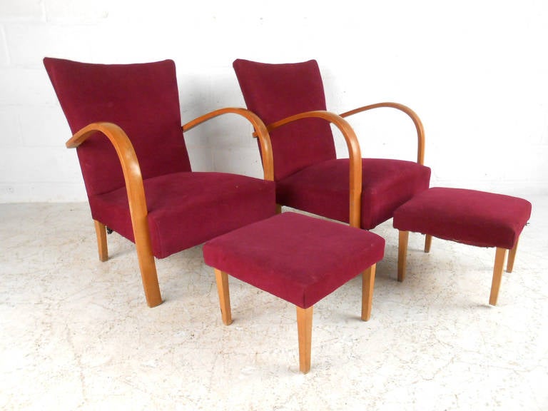 This beautiful pair of bentwood armchairs comes with matching ottomans feature the stylish comfort mid-century design is so well-known for. Unique bentwood construction makes this a visually unique set, ask about matching settee to complete this