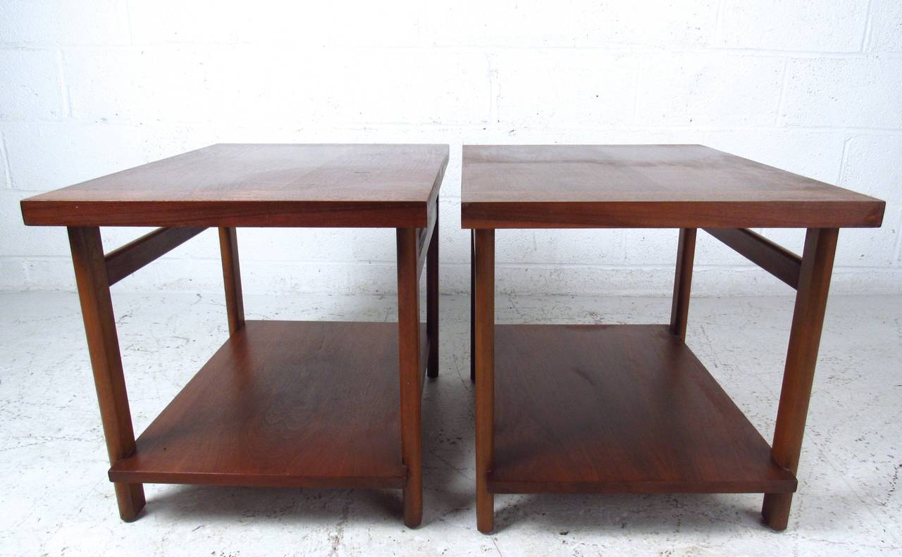 This simple yet stylish pair of mid-century Lane end tables are constructed from quality American walnut, and make a lovely addition to any room. Suitable as sofa or bedside tables, these vintage tables still show the original manufacturers mark.