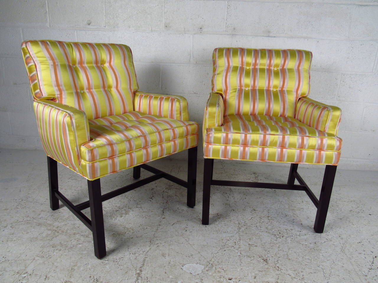 This pair of smaller scale tufted armchairs feature the wonderful mid century design of Dunbar, sport unique tufted seat backs, and have added stretchers for support. Unique size for smaller areas or children's room, please confirm item location (NY