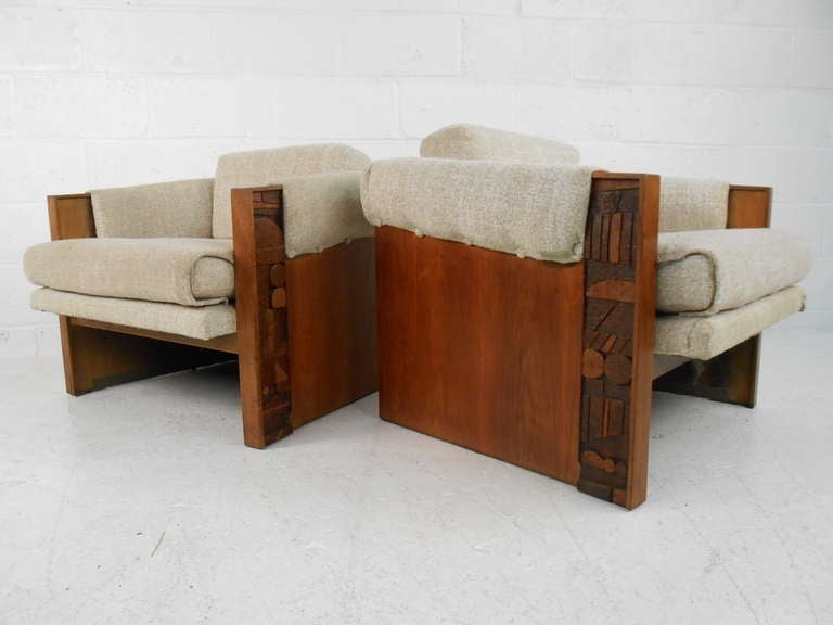 Pair of walnut frame & upholstered lounge chairs in the Brutalist style. Restoration recommended. Please confirm item location (NY or NJ) with dealer.