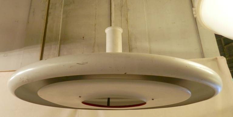 White enameled saucer style hanging lamp from Denmark. Streamlined 