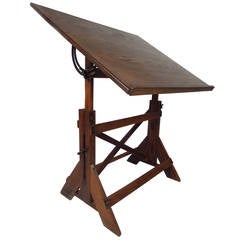 original c. 1950's vintage american industrial varnished maple wood  drafting table with a multitude of drawers