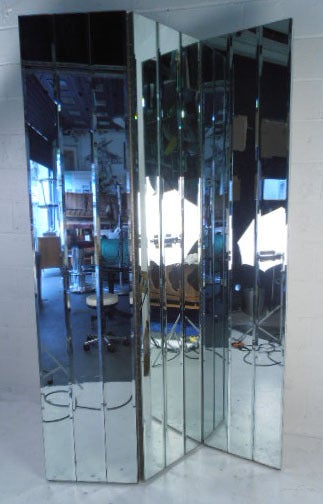 This unusually large room divider/changing mirror features beveled glass and a convenient three-panel design.
