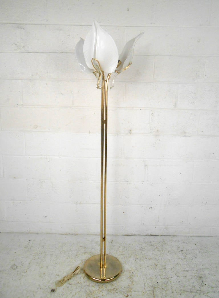 This beautifully designed floor lamp features three light fixtures, each with it's own wonderfully detailed glass leaf. The unique design creates a striking visual impression, while providing ample light for any room. Please confirm item location
