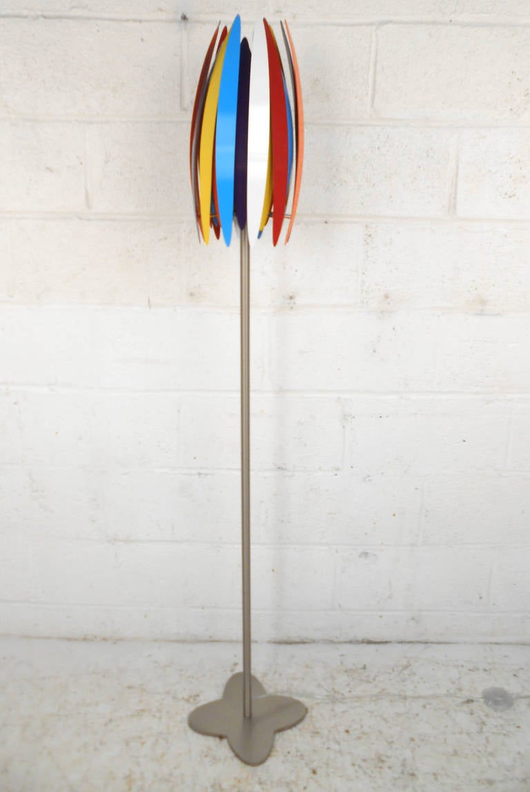 This unique floor lamp combine’s Mid-Century Modern style fixture and petal design with a full spectrum of color. Wonderful addition to lighting for any room in need of a fun accent. Please confirm item location (NY or NJ).