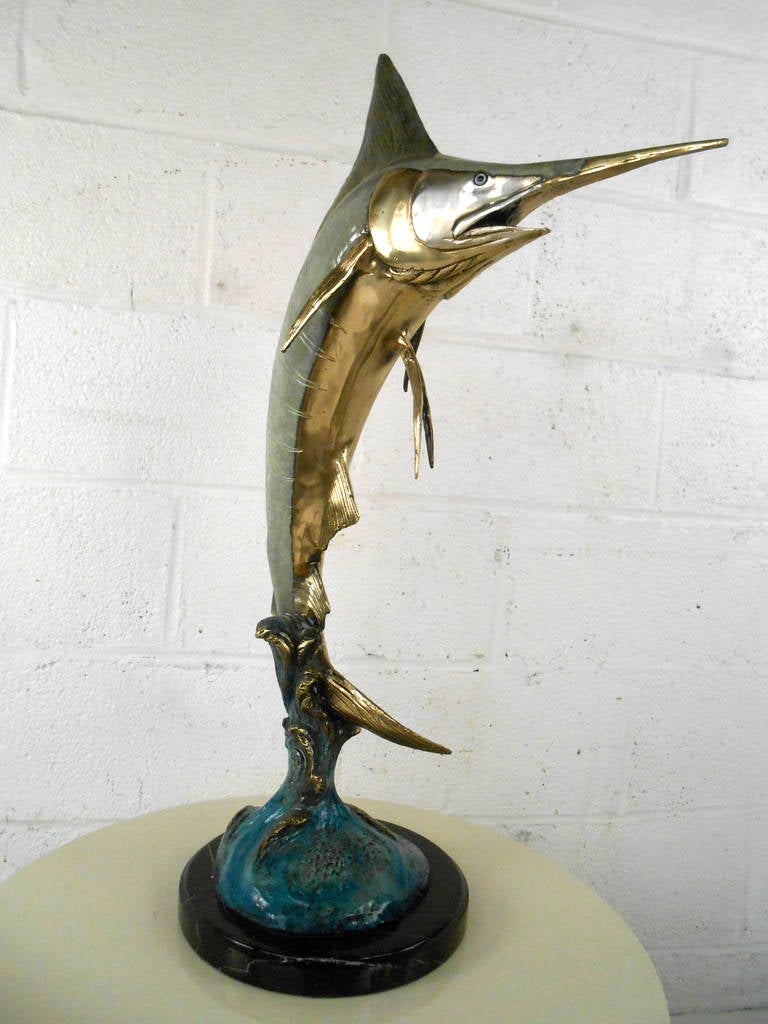 This tabletop Marlin features a wonderful mixture of colors and finishes, and a fantastic attention to details. This heavy bronze statue is a perfect addition to any room in need of an elegant nautical enhancement. Please confirm item location (NY