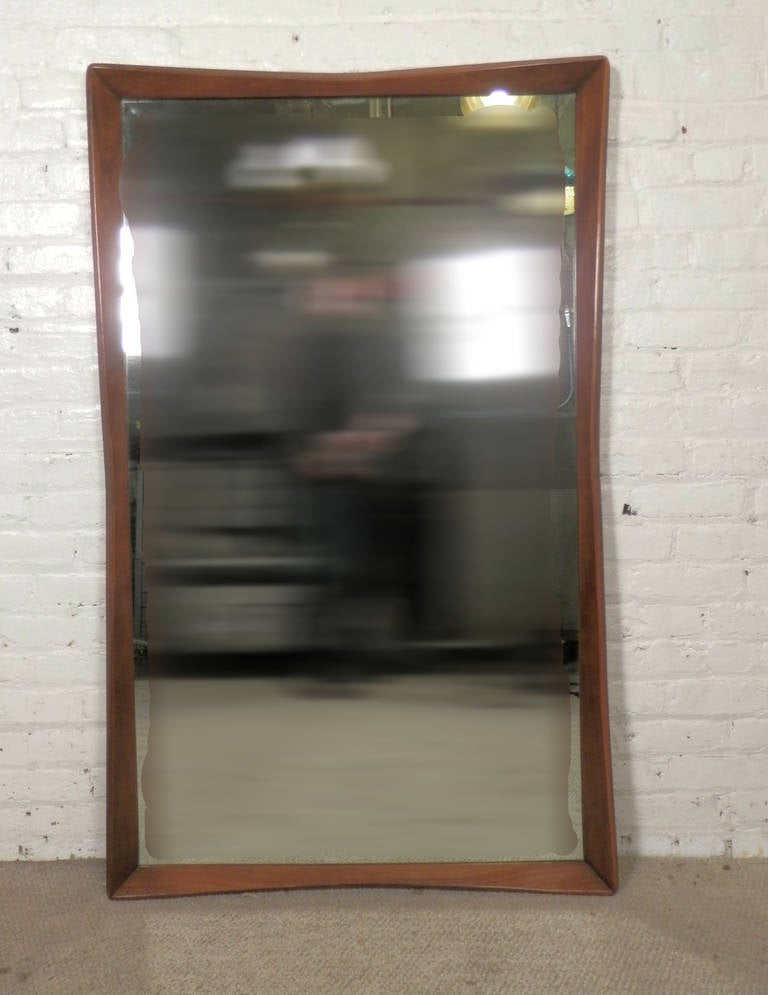 Large wall mirror with spectacular beveled walnut frame. Super sculpted design. Can hang vertical or horizontal.

(Please confirm item location - NY or NJ - with dealer)