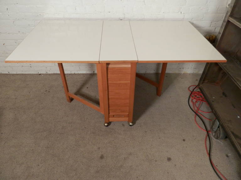 danish modern drop leaf table with folding chairs