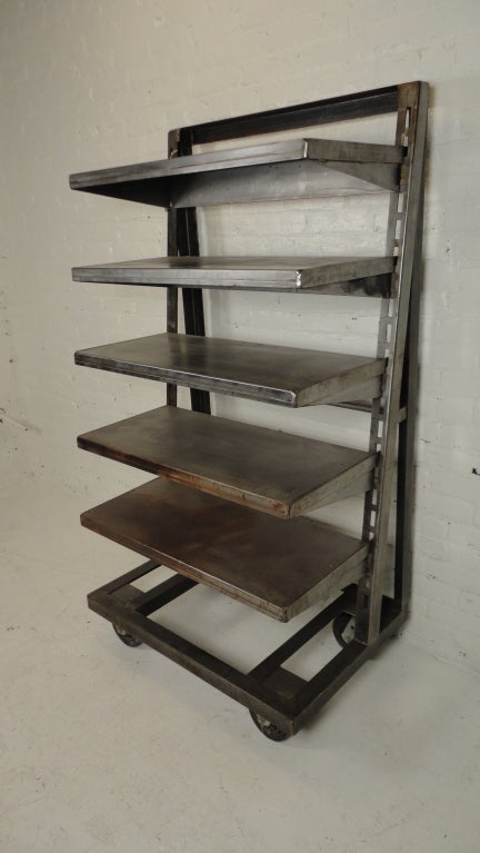 Bare metal, heavy-grade construction with five adjustable shelves. Ideal for retail display.