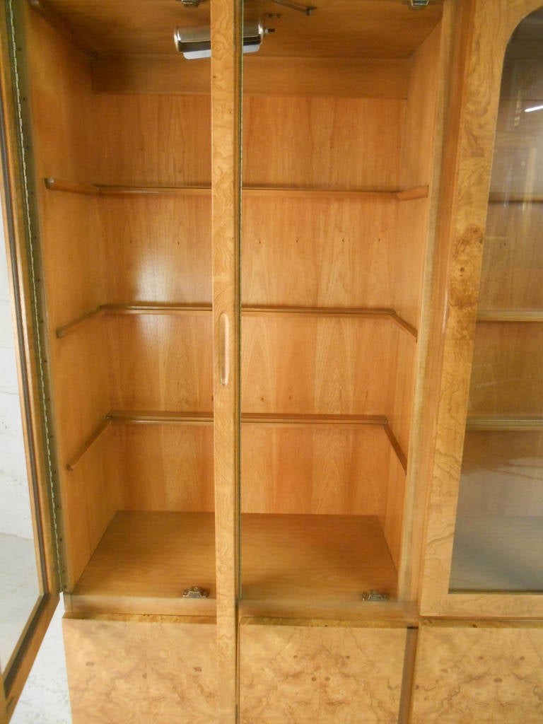 This beautiful two-piece display cabinet features plenty of well lit cabinet display space, as well as ample storage. The beautiful burl finish and quality Lane construction make this a unique addition to any room. Please confirm item location (NY