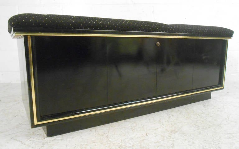 This classic mid-century storage chest features wonderful gold trim and a uniquely patterned upholstered top. Perfect dual use piece for both storage and occasional seating. Please confirm item location (NY or NJ).