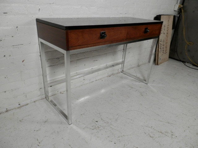 Mid-century Danish modern two drawer console table on simple chrome frame. Classic vintage design by Torbjorn Afdal for Bruskbo. Makes a great console table or desk.