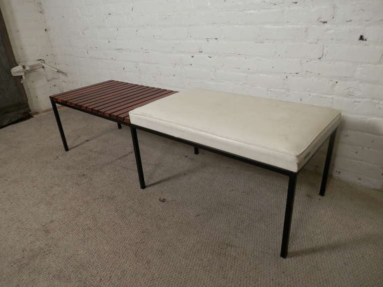 Mid-century modern bench with slat and cushion halves. Solid iron frame, walnut slats and white cushion made by Reilly-Wolf Associates.

(Please confirm item location - NY or NJ - with dealer)