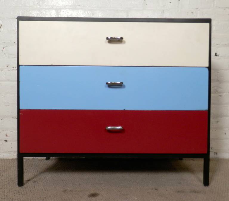 Rare multicolor dresser for Herman Miller. Black iron frame with three painted drawers. Wide storage drawers with oval chrome handles.
Very unique style, great for a child's room. 

(Please confirm item location - NY or NJ - with dealer)