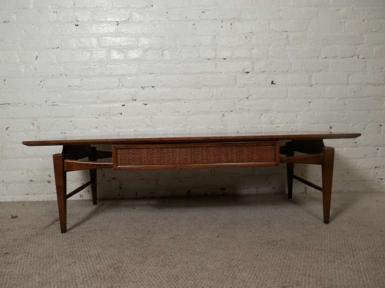 American walnut table with weave front drawer by Lane Furniture. Floating top, tapered legs, nice walnut grain.

(Please confirm item location - NY or NJ - with dealer)