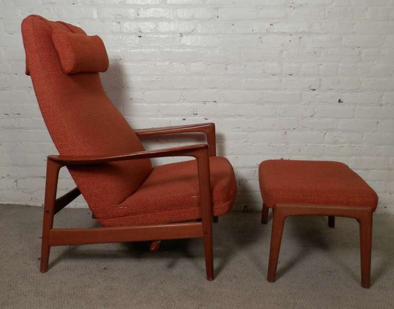 Mid-century modern lounge chair with sculpted teak arms, reclining back and tapered legs. Ottoman lifts for extra comfort when reclining.

(Please confirm item location - NY or NJ - with dealer)