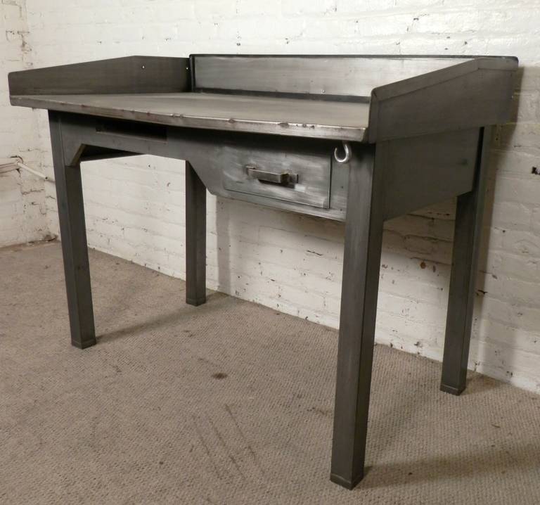 This super cool vintage desk has been restored in a bare metal style finish with light lacquer. Now usable in any modern kitchen, office or store. Refurbished with a new back splash. Heavy duty metal, solid construction, one of a kind style!
Space
