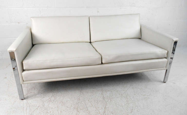 This beautiful sofa has a sturdy chrome frame, and wonderful white vinyl. Comfortable and stylish, this makes a wonderful seating solution for home or business. Please confirm item location (NY or NJ).