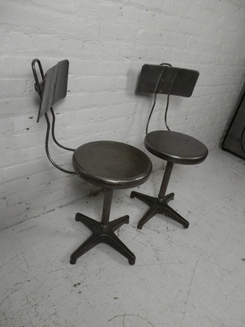 Set of three vintage Ajustrite adjustable stools made by the Ajusto Equipment Co. of Toledo, OH. Stool features swiveling 13