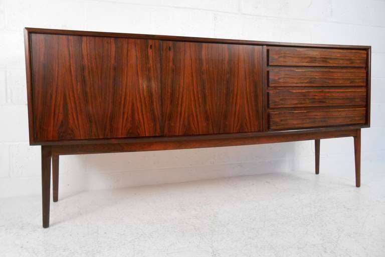 Elegant, well-crafted rosewood credenza made in Denmark by Maurice Villency. Please confirm item location (NY or NJ) with dealer.