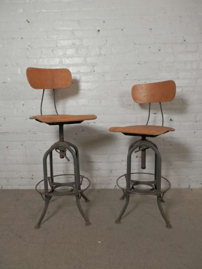 Two fantastic Toledo style adjustable stools by the Bruning Company. Heights range from 25