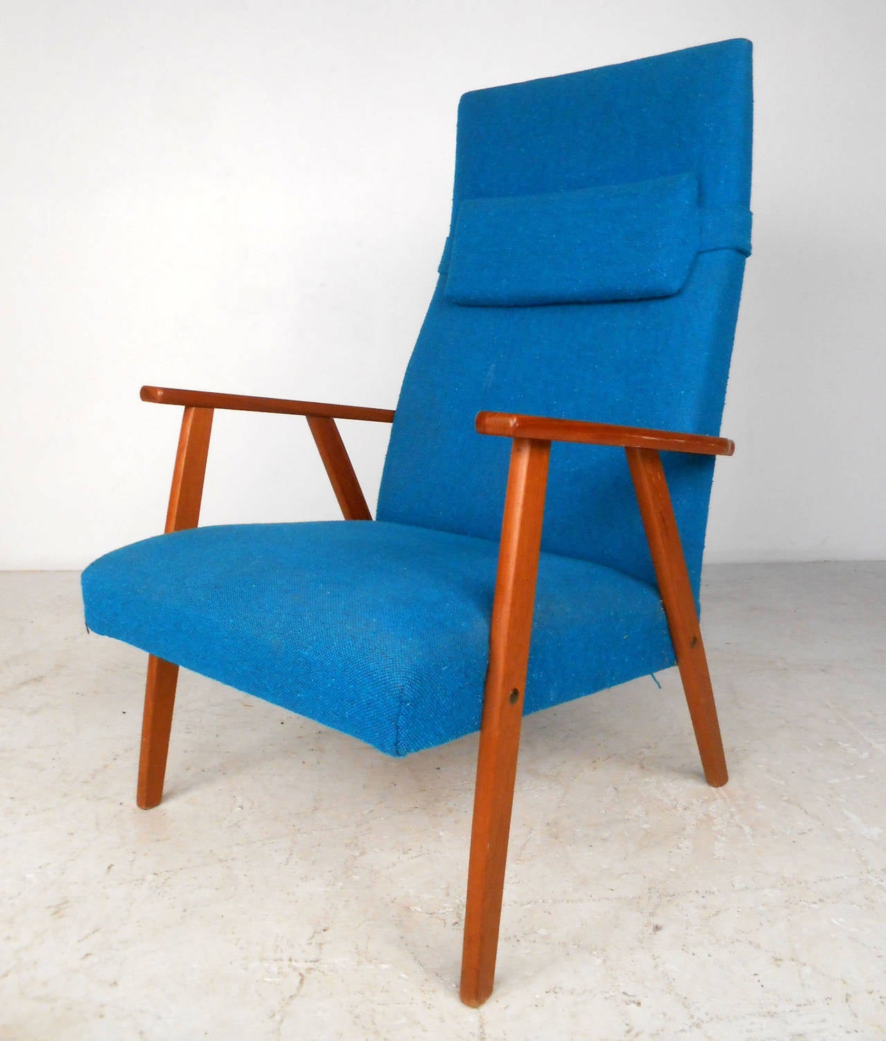 This beautiful vintage armchair features sturdy Mid-Century construction and a comfortable molded high backseat. Perfect lounge chair in wonderful vintage fabric. Removable headrest and retro style make this a great addition to any room. Please