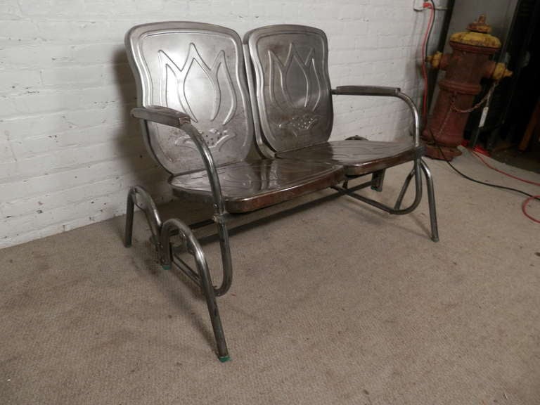 Two seat glider and pair of spring chairs. Great floral relief on back and seats. Pieces have been striped and lacquered for a striking industrial look.

Glider - 44w 29d 31h
Chairs - 22w 27d 33h

(Please confirm item location - NY or NJ - with