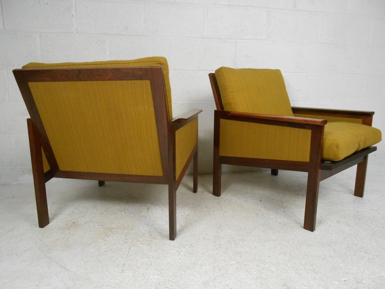 Comfortable pair of nicely detailed rosewood lounge chairs. 